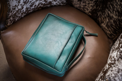 Western turquoise Bible cover back view resting on chair designed by Jennifer Smith of STS Ranch 