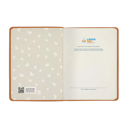 An open custom journal shown flat against a white background. The left page features a light beige background with a repeating pattern of small white butterflies, and the right page is blank with a printed welcome message and the 'LOGOS TAP' brand logo at the top.
