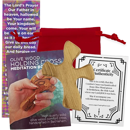 Olive wood holding cross meditation box set with a red drawstring pouch, wooden cross, certificate of authenticity, and a colorful prayer card on a white background.