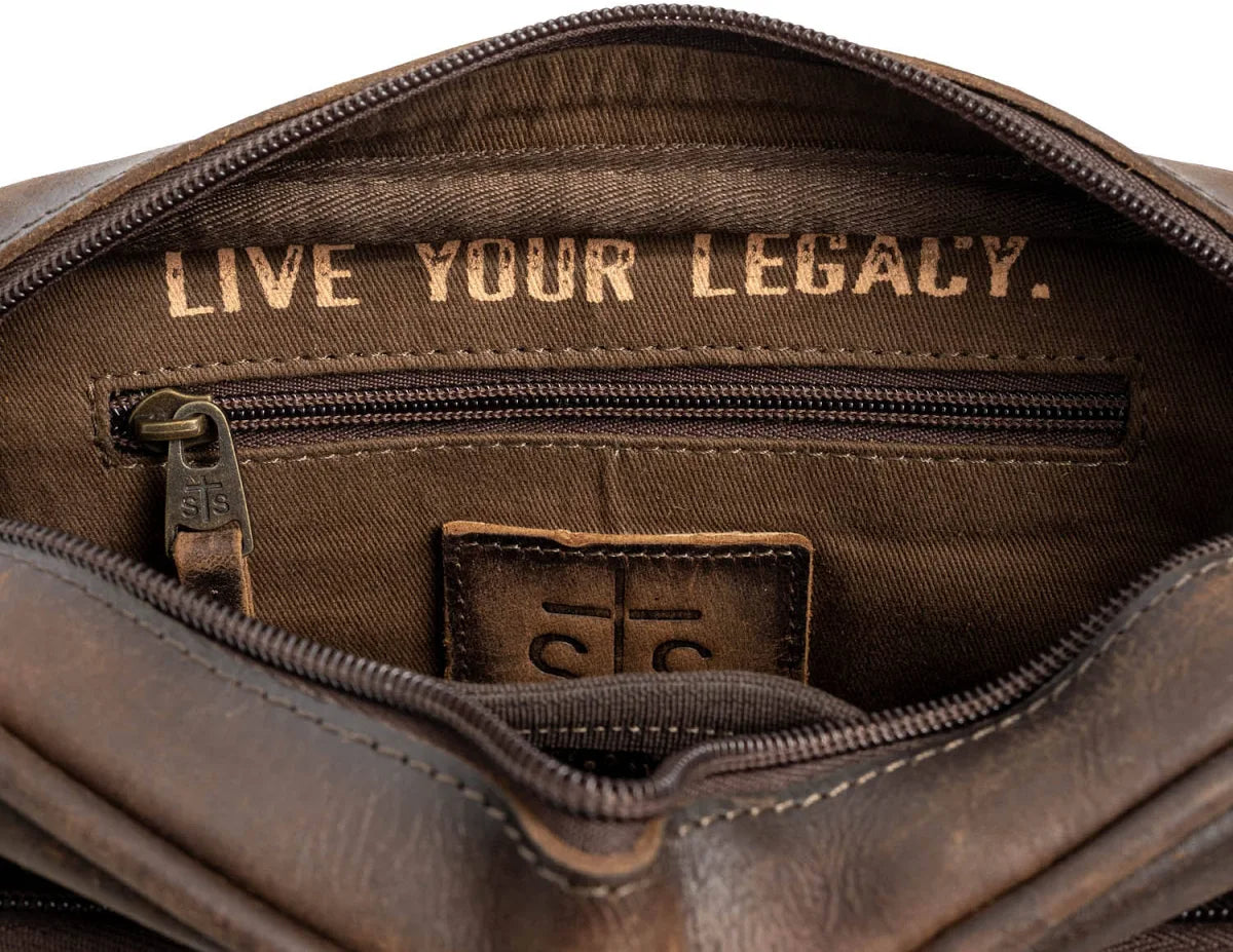 Inside of STS Ranchwear Cowhide Jess Crossbody with words "Leave Your Legacy"