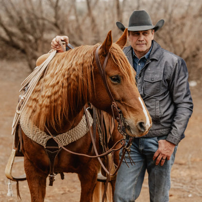 STS Ranch Signature Tack Harness Leather Split Ear Headstall, 3/4" on a horse in a pasture in winter with Stran Smith STS Ranch